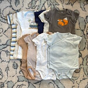 10 pieces. 6-9 month baby boy onesies